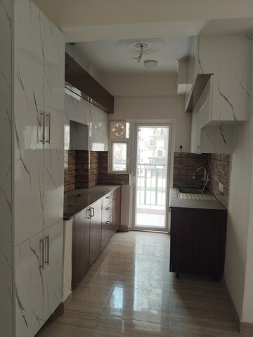 Kitchen in 3 BHK Apartment at Amrapali Terrace Homes, Tech Zone 4 Greater Noida – for Rent