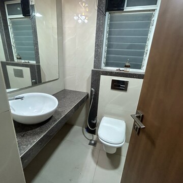 Bathroom in 4 BHK Apartment at Sheth Vasant Lawns, Oswal Park – for Rent