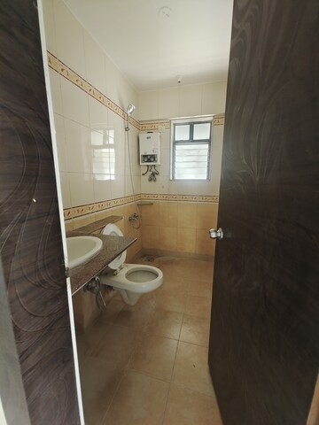 Bathroom in 2 BHK Apartment at Jasmine Tower, Vasant Vihar – for Rent