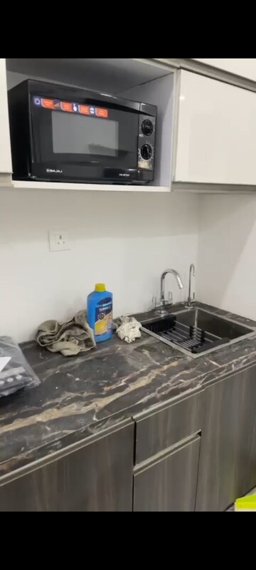 Kitchen in Studio Apartment at Supertech North Eye, Sector 74 – for Rent