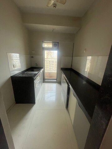Kitchen in 2 BHK Apartment at Rustomjee Azziano Wing E, Majiwada – for Rent