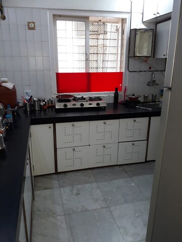 Kitchen in 2 BHK Apartment at Queens Land Apartment, Andheri West – for Sale