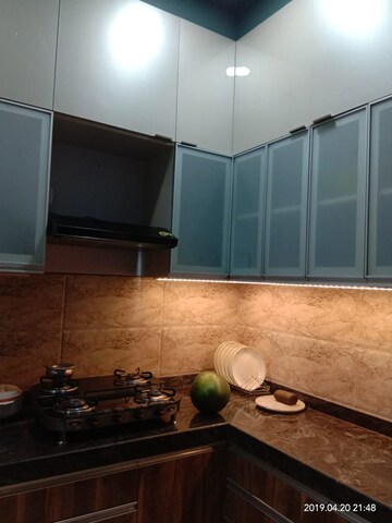 Kitchen in 2 BHK Apartment at Harmony Signature Towers, Owale – for Rent