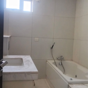 Bathroom in 3 BHK Apartment at Tata Raheja Raisina Residency, Sector 59 – for Sale