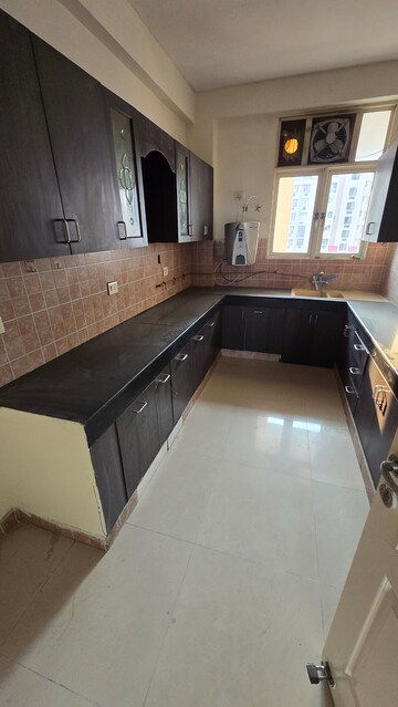 Kitchen in 3 BHK Apartment at Eldeco Green Meadows, Pi Greater Noida – for Rent