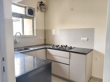 Kitchen in 1 BHK Apartment at Hiranandani Estate Solitaire C, Ghodbunder Road – for Rent