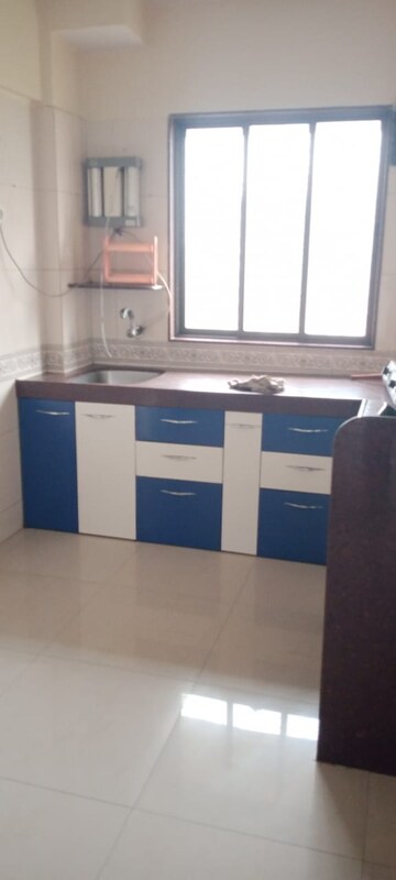Kitchen in 2 BHK Apartment at Nilgiri Upvan CHS, Gawand Baug – for Rent