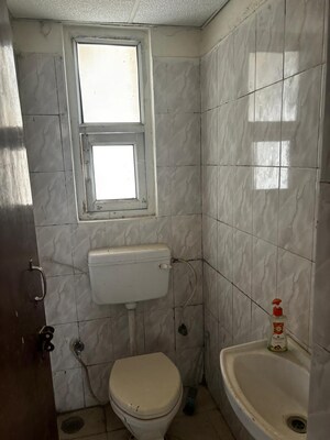 Bathroom in 2 BHK Apartment at MGI Gharaunda, Raj Nagar Extension – for Sale