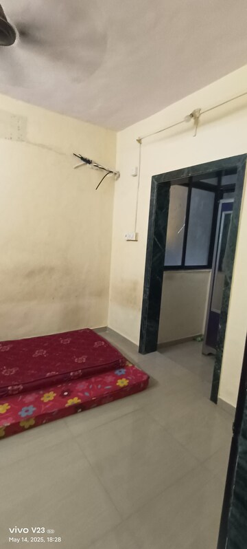 Bedroom in 1 BHK Apartment at Vasundhara CHS Gokuldham, Gokuldham Colony – for Rent