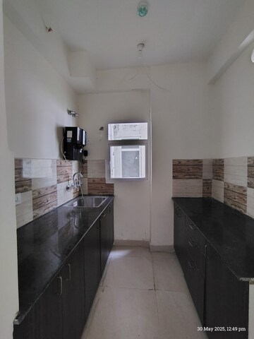 Kitchen in 2 BHK Apartment at Amrapali Enchante, Tech Zone 4 Greater Noida – for Sale