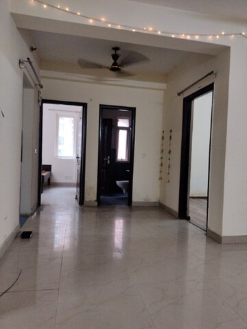 Living Room in 2.5 BHK Apartment at Sikka Karmic Greens, Sector 78 – for Rent