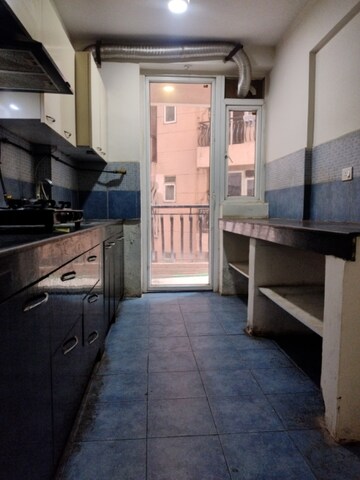 Kitchen in 2.5 BHK Apartment at Sikka Karmic Greens, Sector 78 – for Rent