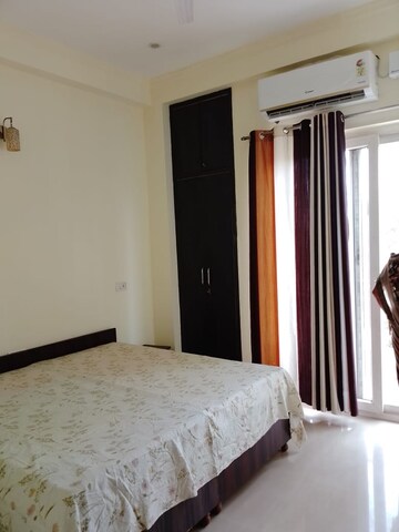 Bedroom in 3 BHK Builder Floor at Ansal API Esencia, Sector 67 – for Rent