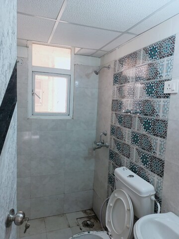 Bathroom in 2 BHK Apartment at Signature Global Proxima, Sector 89 – for Rent