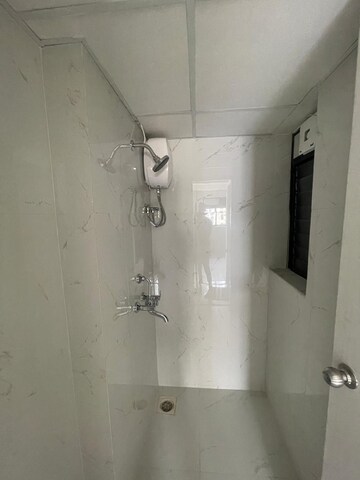 Bathroom in 1 BHK Apartment at Runwal Gardens, Dombivli East – for Rent