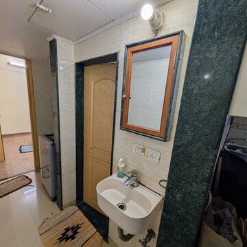 Bathroom in 1 BHK Apartment at Hilton Tower, Andheri East – for Rent