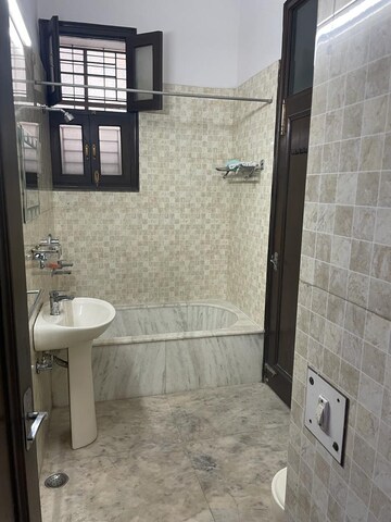 Bathroom in 2 BHK Builder Floor at Defence Colony – for Rent