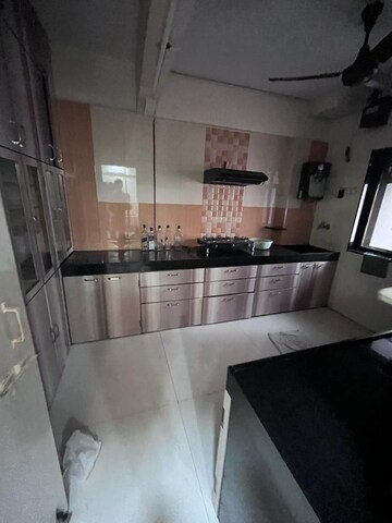 Kitchen in 2 BHK Apartment at Venus Upvan CHS, Gawand Baug – for Rent
