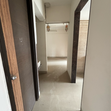 Building Lobby in 1 BHK Apartment at Tharwani Vedant Millenia, Titwala – for Rent
