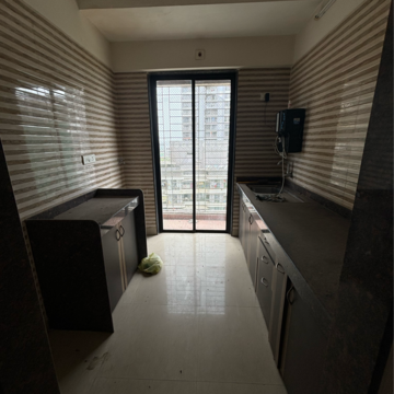 Building Lobby in 1 BHK Apartment at Tharwani Vedant Millenia, Titwala – for Rent