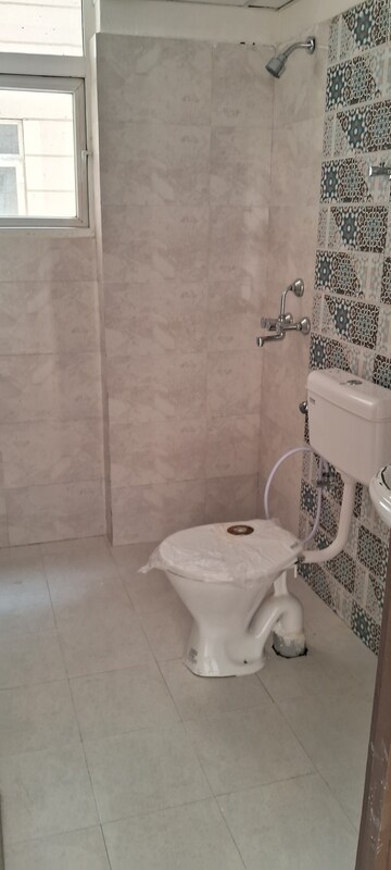 Bathroom in 2 BHK Apartment at Signature Global Proxima, Sector 89 – for Rent