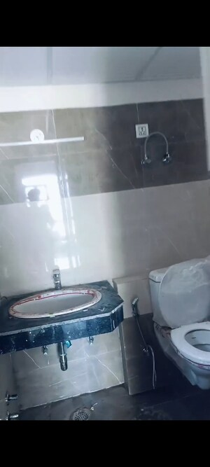 Bathroom in 1 BHK Apartment at Cosmos Express 99, Sector 99 – for Sale