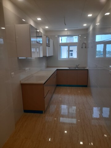Kitchen in 3.5 BHK Builder Floor at Puri Aman Vilas, Sector 89 – for Sale
