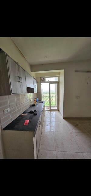 Kitchen in 3 BHK Apartment at Signature Global Grand Iva, Sector 103 – for Sale