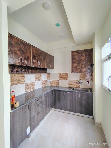 Kitchen in 2 BHK Apartment at Amrapali Enchante, Tech Zone 4 Greater Noida – for Rent