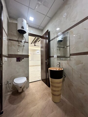Bathroom in 4 BHK Builder Floor at Niti Khand I – for Rent