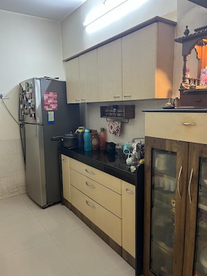 Kitchen in 2 BHK Apartment at Ochna Pride Park CHS Ltd, Ghodbunder Road – for Sale