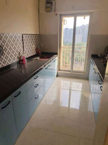 Kitchen in 2 BHK Apartment at Shree Tirupati STG Signature Residency, Patlipada – for Rent