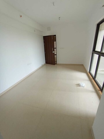 Living Room in 2 BHK Apartment at Lodha Palava Downtown, Dombivli East – for Rent