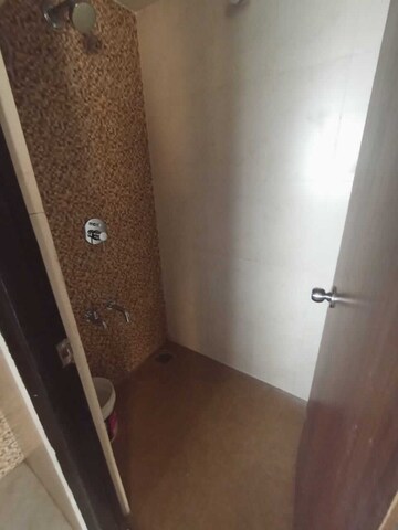 Bathroom in 1 BHK Apartment at Lodha Lakeshore Greens, Dombivli East – for Rent