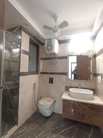 Bathroom in 4 BHK Apartment at Greater Kailash – for Rent