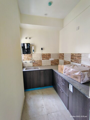 Kitchen in 2 BHK Apartment at Amrapali Enchante, Tech Zone 4 Greater Noida – for Rent