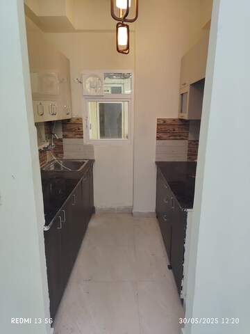 Kitchen in 2 BHK Apartment at Tech Zone 4 Greater Noida – for Rent