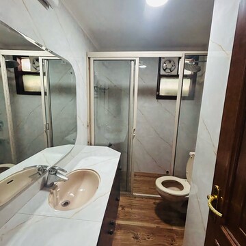 Bathroom in 3 BHK Apartment at Ambience Island Lagoon, National Media Center – for Rent