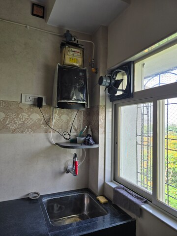 Kitchen in 2 BHK Apartment at Kalpataru Hills, Manpada – for Rent