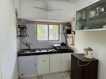 Kitchen in 2 BHK Apartment at Nirman Kutir, Yari Road – for Rent