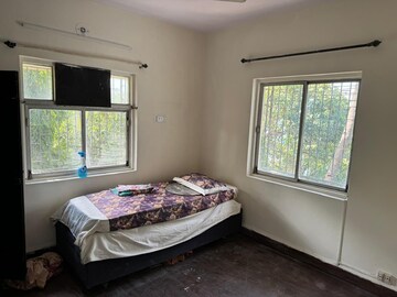 Bedroom in 2 BHK Apartment at Nirman Kutir, Yari Road – for Rent