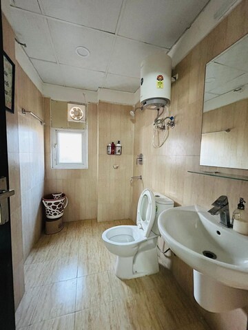 Bathroom in 3 BHK Apartment at Aims Golf Avenue II, Sector 75 – for Rent