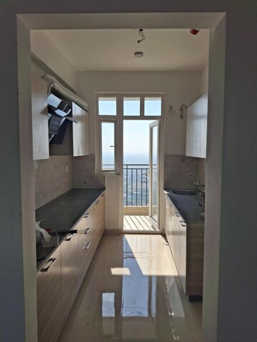 Kitchen in 3 BHK Apartment at Mahagun Mezzaria, Sector 78 – for Rent