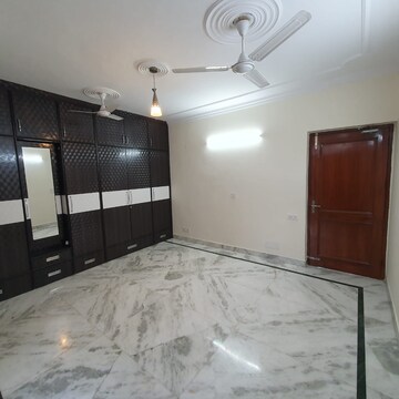 Bedroom in 4 BHK Builder Floor at Sarvodaya Enclave – for Rent