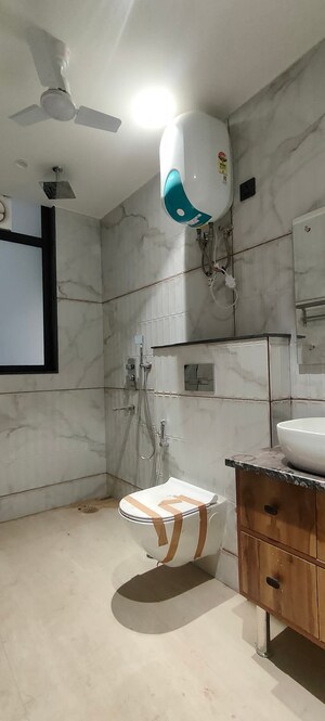 Bathroom in 4 BHK Apartment at Green Wood City, Sector 45 – for Sale