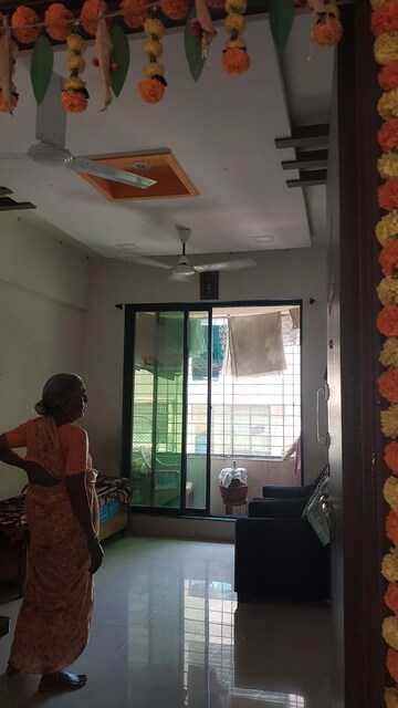 Living Room in 1 BHK Apartment at Kopar Khairane Sector 19 – for Sale