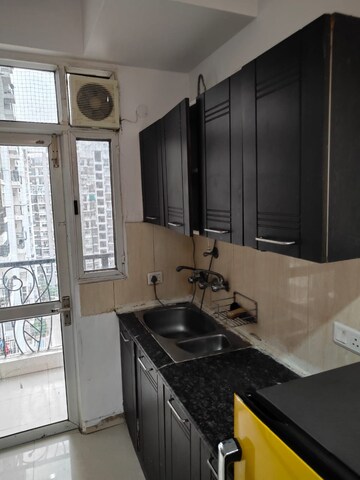 Kitchen in 2 BHK Apartment at Prateek Wisteria, Sector 77 – for Rent