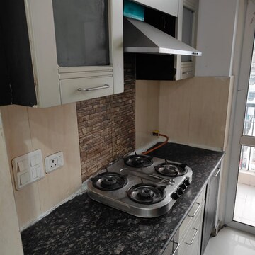 Kitchen in 2.5 BHK Apartment at Prateek Wisteria, Sector 77 – for Rent
