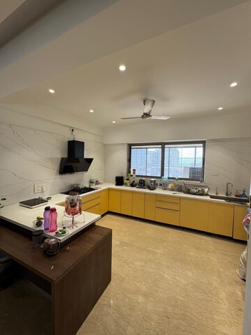 Kitchen in 4 BHK Apartment at Model Colony – for Sale