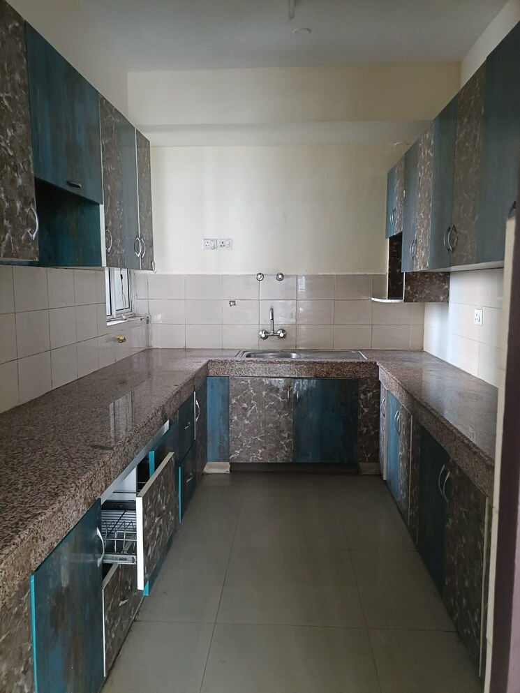 Kitchen, logix-blossom-greens 2.5 Bedroom 1234 Sq.Ft. Apartment In Sector 143 Noida 8764746